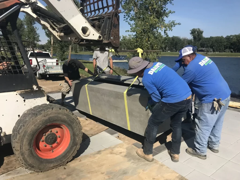 Workers unloading cement planters